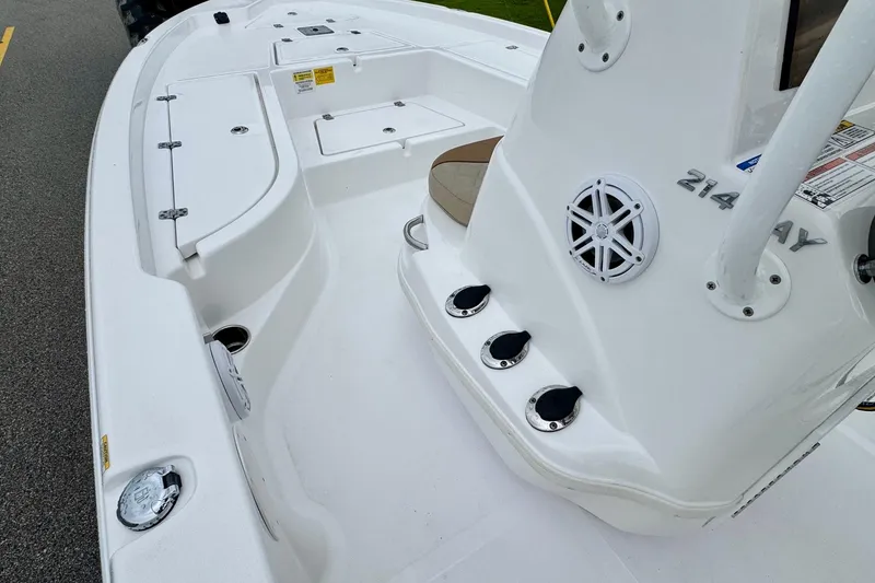 Slide: The Image of 2024 NauticStar 214 Bay boat interior with storage compartments and speaker system. - 11