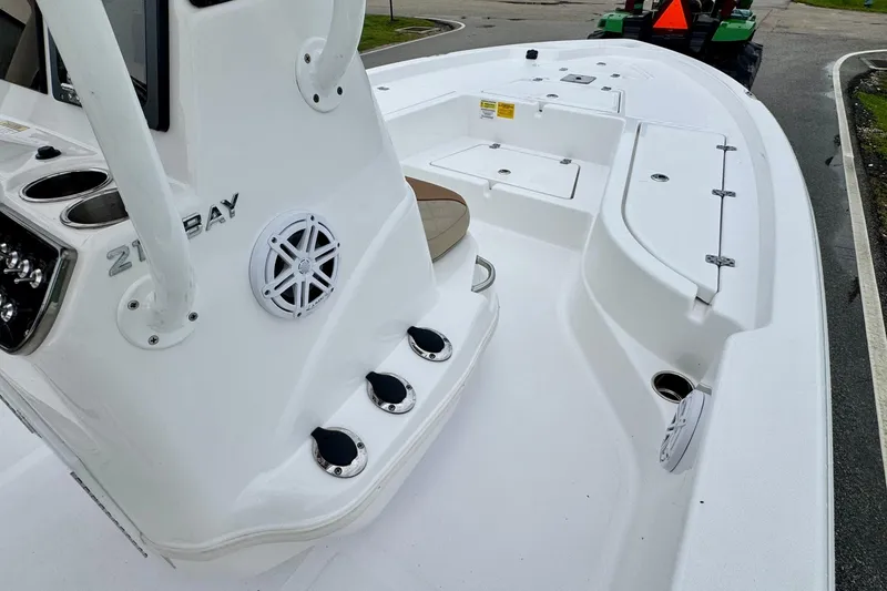 Slide: The Image of 2024 NauticStar 214 Bay boat interior with console and seating, showcasing sleek design. - 13