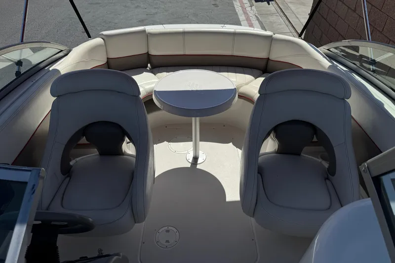Slide: The Image of Interior of a 2003 Four Winns 214 Funship boat with seating and table. - 18