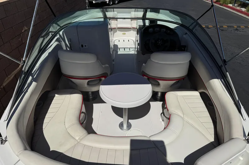 Slide: The Image of 2003 Four Winns 214 Funship boat interior with seating and table, showcasing luxury design. - 22