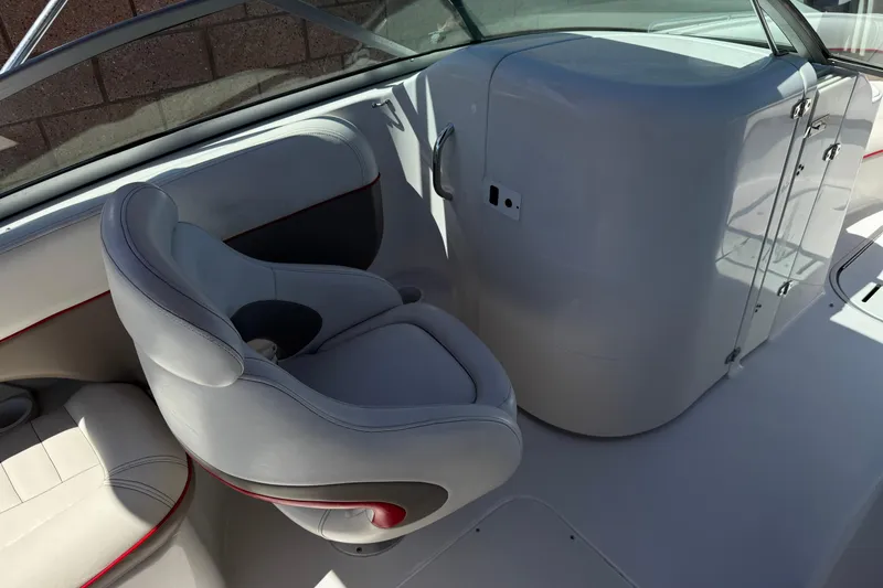 Slide: The Image of Interior of 2003 Four Winns 214 Funship boat, featuring comfortable seating and sleek design. - 23