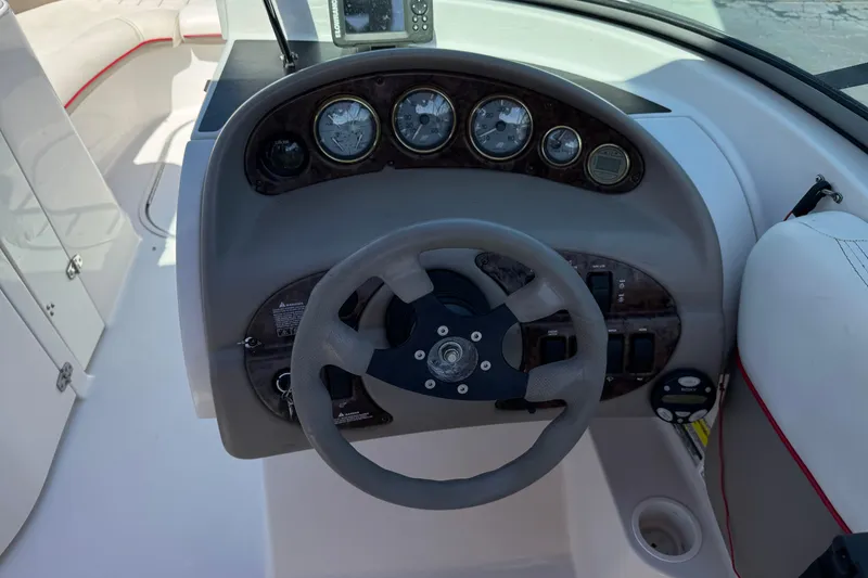 Slide: The Image of 2003 Four Winns 214 Funship dashboard with steering wheel and instrument panel. - 26