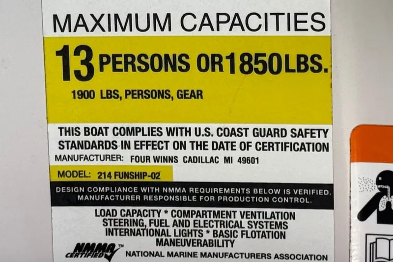 Slide: The Image of 2003 Four Winns 214 Funship capacity label: 13 persons or 1850 lbs, USCG compliant. - 30