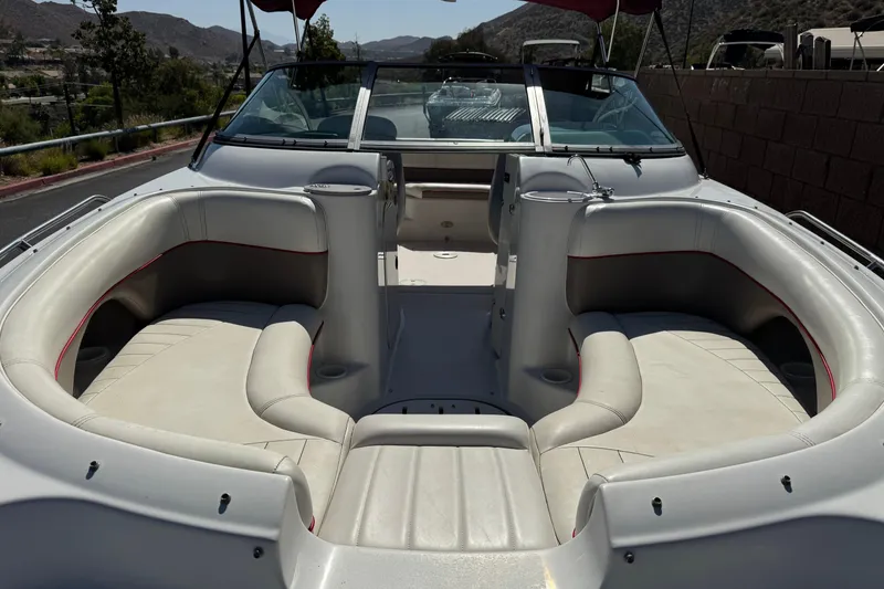 Slide: The Image of 2003 Four Winns 214 Funship boat interior with spacious seating and windshield. - 9