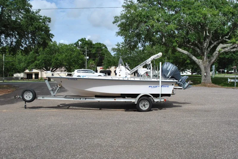 The Image of 2007 Blue Wave 180 V-Bay boat on trailer in parking lot. - 1