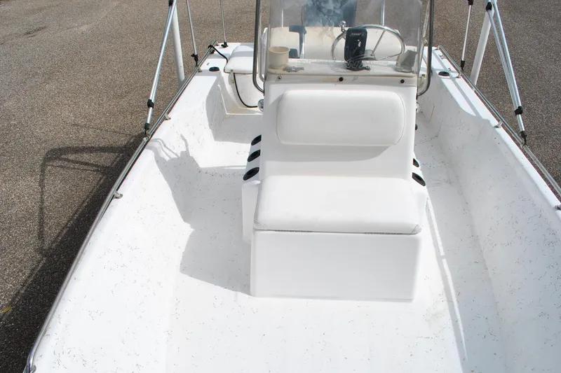 Slide: The Image of 2007 Blue Wave 180 V-Bay boat interior with white seating and steering console. - 14