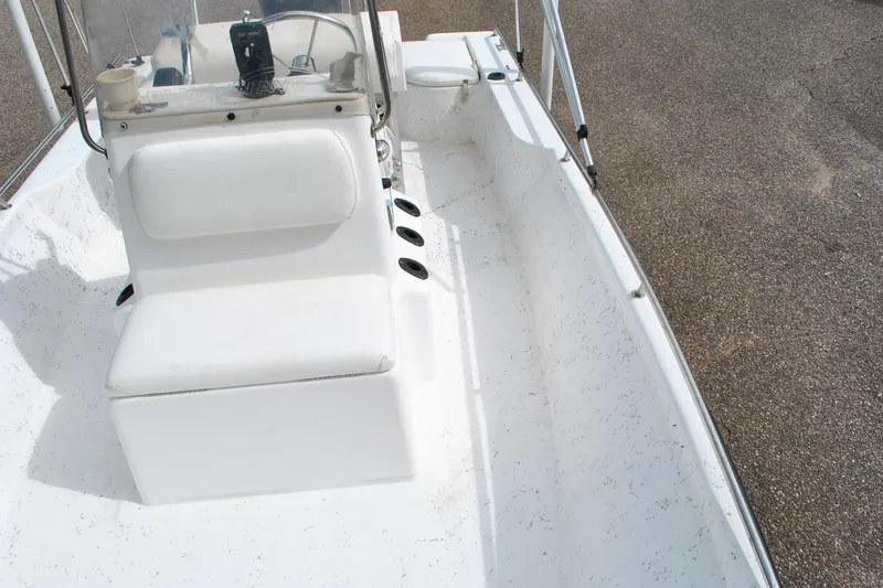 Slide: The Image of 2007 Blue Wave 180 V-Bay boat interior with white seating and console. - 16