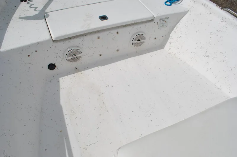Slide: The Image of 2007 Blue Wave 180 V-Bay boat interior with speakers and storage compartment. - 17