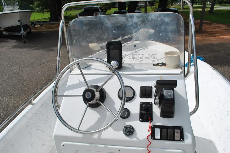 Slide: The Image of Steering console of a 2007 Blue Wave 180 V-Bay boat with controls and gauges. - 22