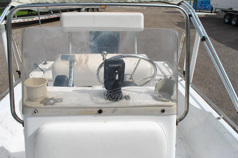 Slide: The Image of 2007 Blue Wave 180 V-Bay boat console with Garmin device and steering wheel. - 23