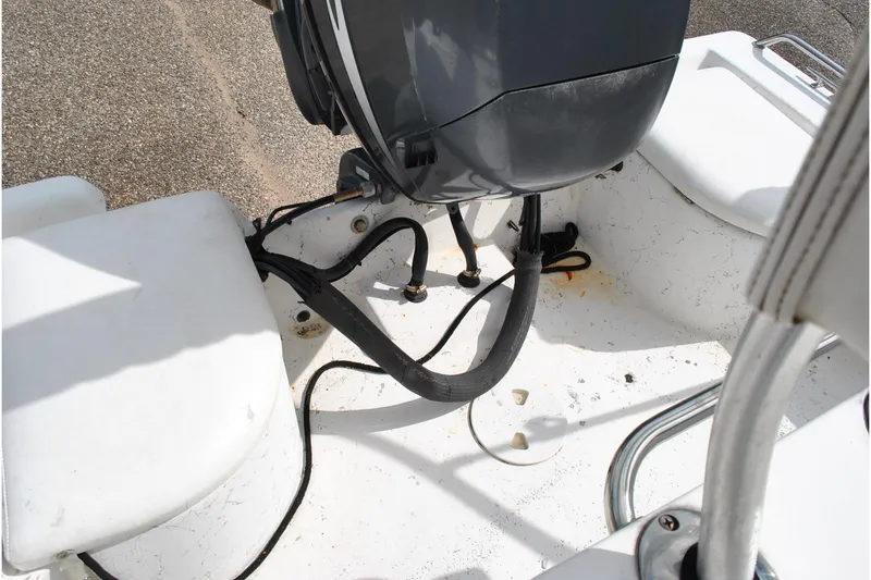 Slide: The Image of 2007 Blue Wave 180 V-Bay boat engine area with cables and seating. - 24
