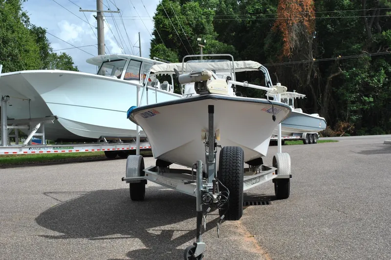 Slide: The Image of 2007 Blue Wave 180 V-Bay boat on trailer, parked near other boats. - 3