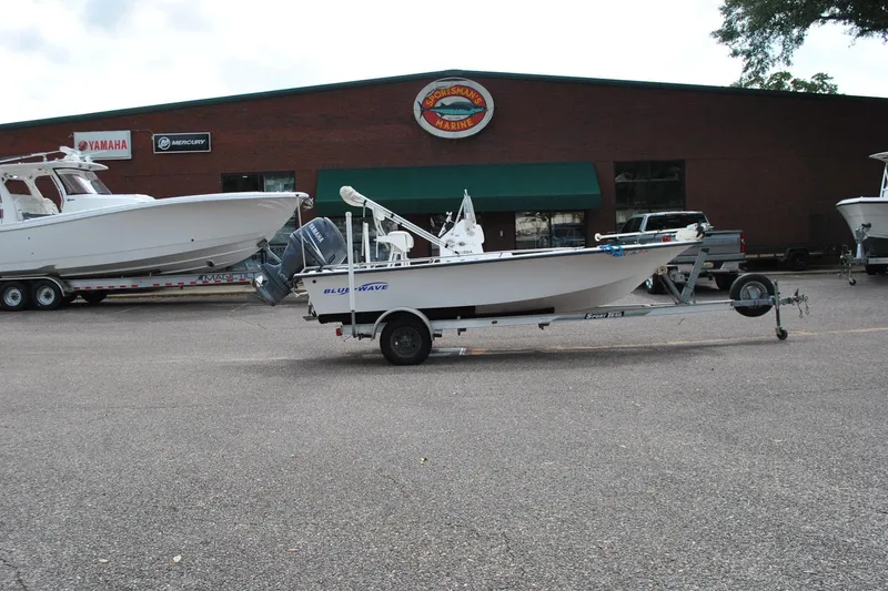 Slide: The Image of 2007 Blue Wave 180 V-Bay boat on trailer outside dealership. - 5