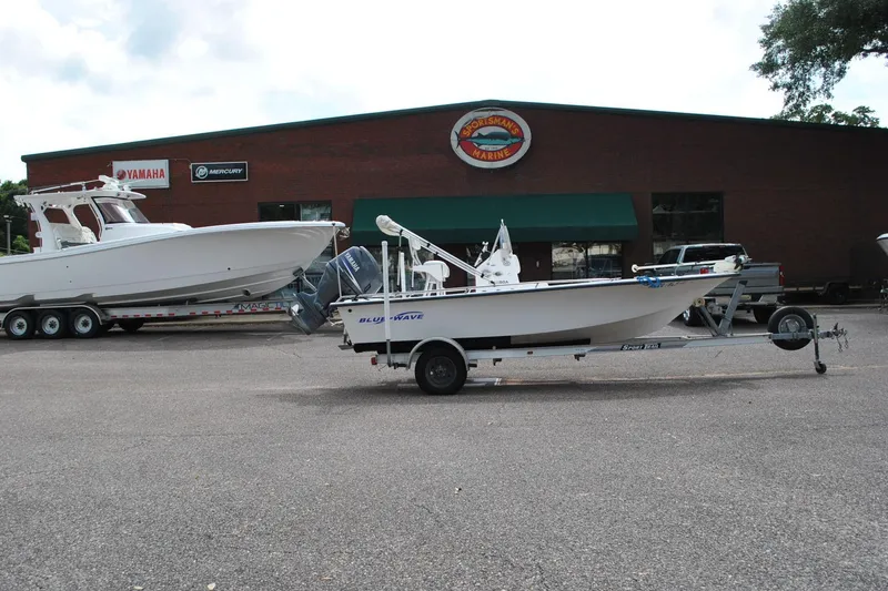 Slide: The Image of 2007 Blue Wave 180 V-Bay boat on trailer outside marine dealership. - 6