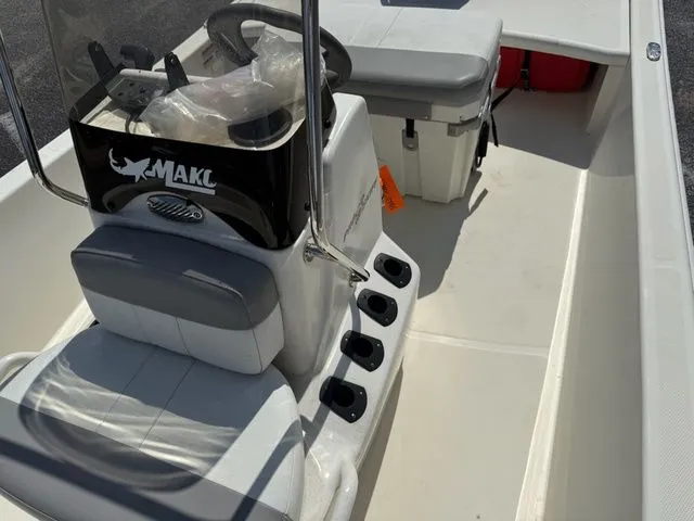 Slide: The Image of Interior view of the 2023 Mako Pro Skiff 15 CC boat. - 11