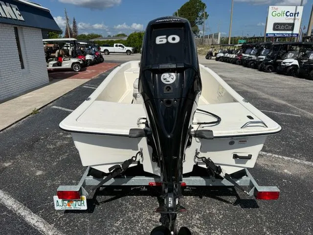 Slide: The Image of 2023 Mako Pro Skiff 15 CC with 60 HP motor on trailer. - 5