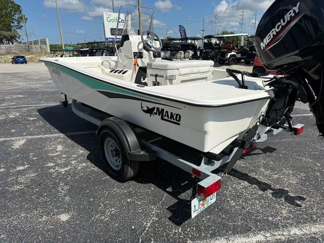 Slide: The Image of 2023 Mako Pro Skiff 15 CC on trailer outdoors. - 6