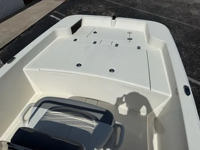 Slide: The Image of 2023 Mako Pro Skiff 15 CC boat deck in sunlight. - 9
