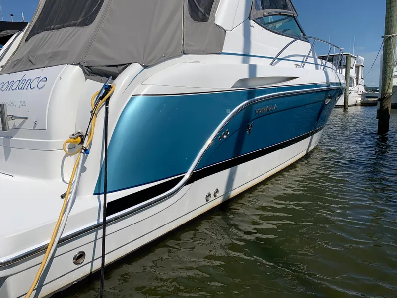 Slide: The Image of 2005 Formula 34 PC boat docked in marina. - 1