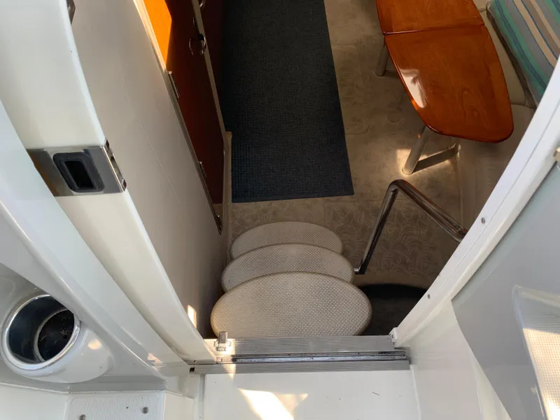 Slide: The Image of 2005 Formula 34 Performance Cruiser interior with stairs and seating area. - 23