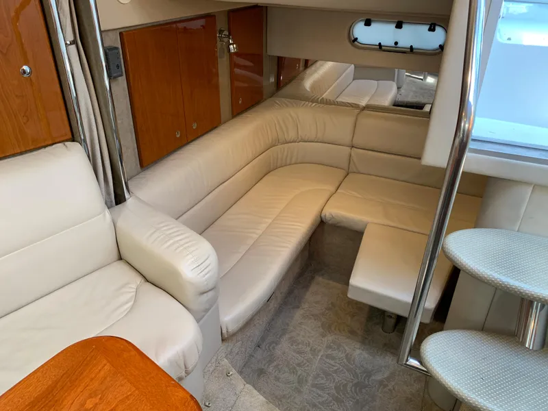 Slide: The Image of 2005 Formula 34 Performance Cruiser interior with beige leather seating and wooden accents. - 33