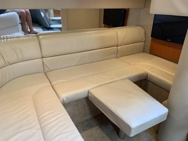 Slide: The Image of 2005 Formula 34 Performance Cruiser interior with cream leather seating and compact table. - 34