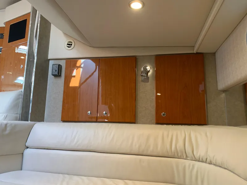 Slide: The Image of Interior of 2005 Formula 34 Performance Cruiser with wood cabinets and white seating. - 36