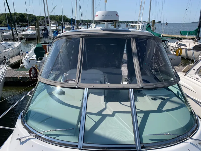 Slide: The Image of 2005 Formula 34 Performance Cruiser docked at marina, front view with clear windshield. - 39