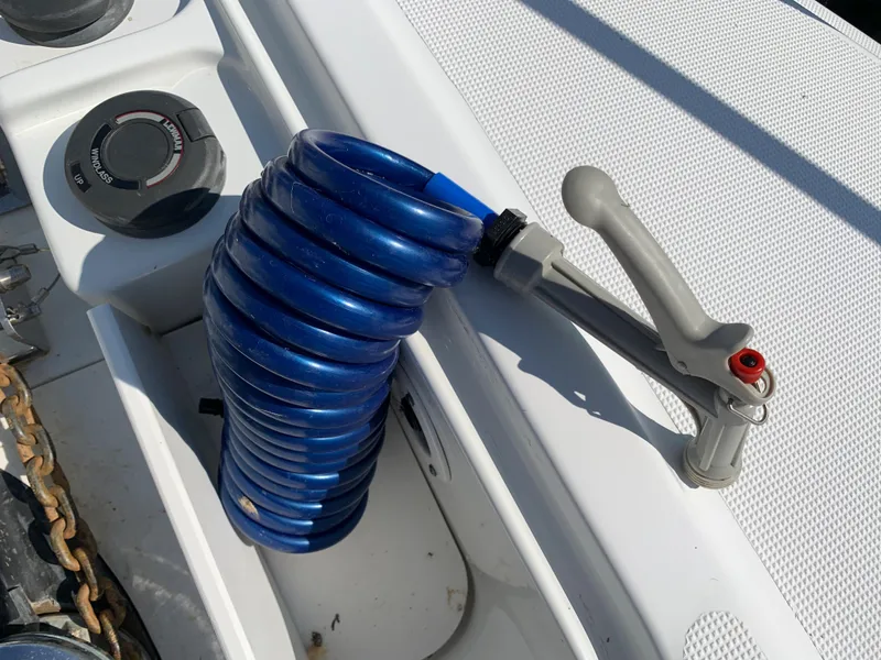 Slide: The Image of Coiled blue hose on 2005 Formula 34 Performance Cruiser deck. - 44