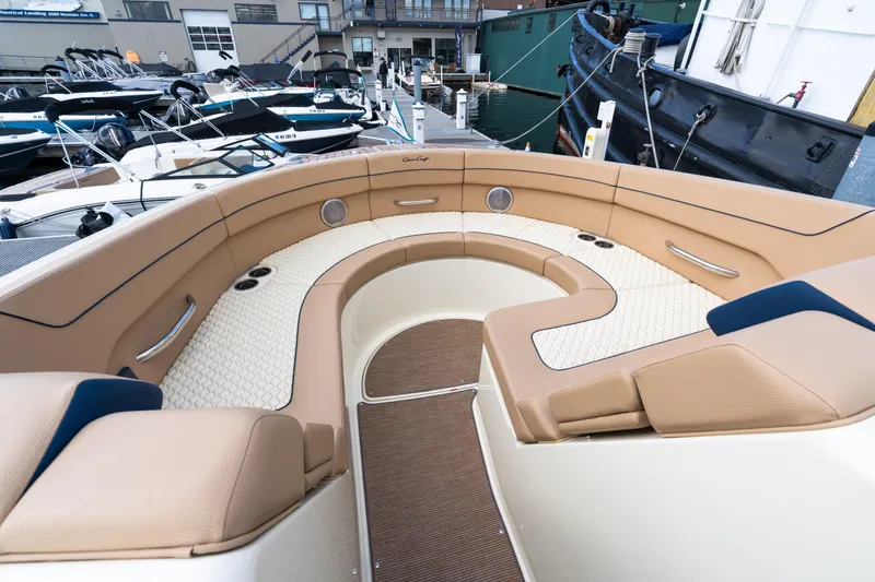 Slide: The Image of Luxurious seating area on the 2025 Chris-Craft Launch 35 GT boat, docked at a marina. - 11