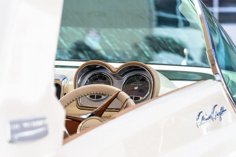 Slide: The Image of 2025 Chris-Craft Launch 35 GT dashboard with elegant steering and classic gauges. - 13