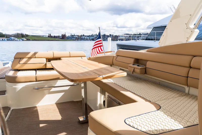 Slide: The Image of Luxurious seating area on 2025 Chris-Craft Launch 35 GT boat with elegant design. - 19