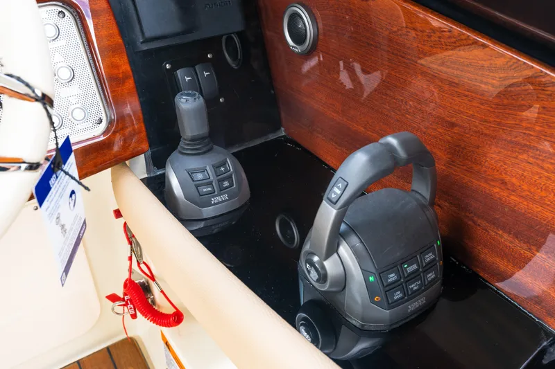 Slide: The Image of Control panel of 2025 Chris-Craft Launch 35 GT with joystick and throttle controls. - 7