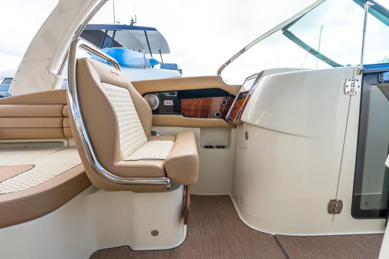 Slide: The Image of 2025 Chris-Craft Launch 35 GT interior with luxurious seating and elegant dashboard design. - 9