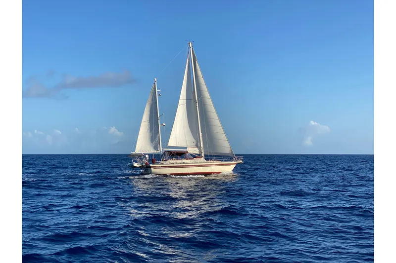 The Image of Sailing yacht Stamas 44 from 1984 gliding on open ocean under clear blue sky. - 0