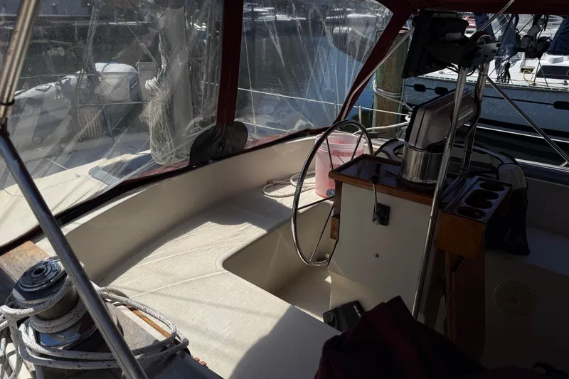Slide: The Image of Cockpit of a 1984 Stamas 44 boat with steering wheel and navigation equipment. - 10