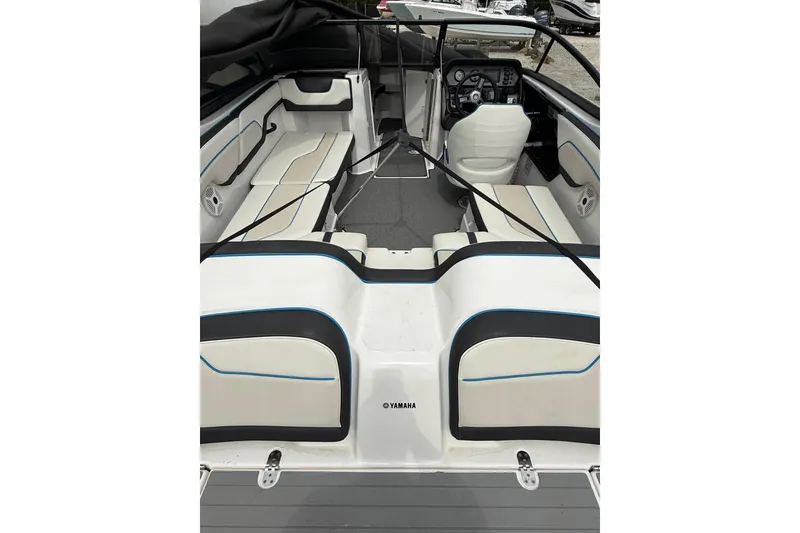 Slide: The Image of 2019 Yamaha AR210 boat interior with seating and dashboard view. - 10
