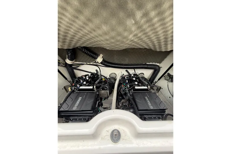 Slide: The Image of 2019 Yamaha AR210 boat engine compartment with dual Yamaha engines. - 17