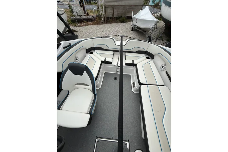 Slide: The Image of 2019 Yamaha Boats AR210 interior with spacious seating and modern design. - 18