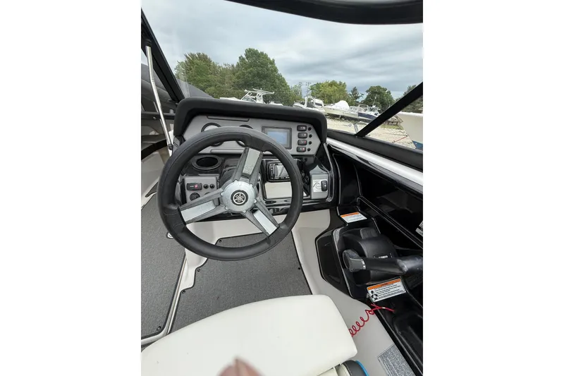 Slide: The Image of 2019 Yamaha Boats AR210 dashboard with steering wheel and control panel. - 20