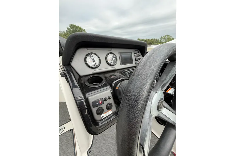 Slide: The Image of 2019 Yamaha Boats AR210 dashboard with steering wheel and control gauges. - 22