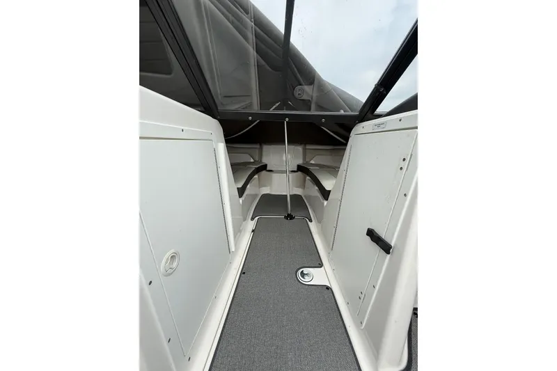 Slide: The Image of 2019 Yamaha AR210 boat interior with seating and storage compartments. - 27