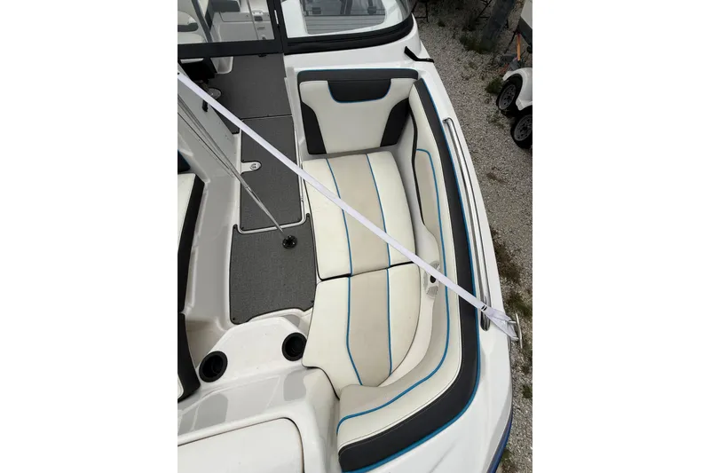 Slide: The Image of 2019 Yamaha Boats AR210 interior seating with white and blue accents. - 29