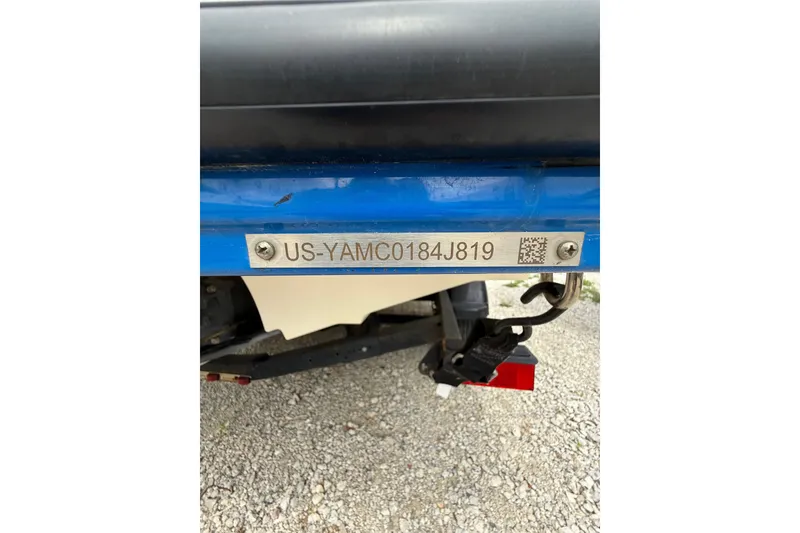 Slide: The Image of 2019 Yamaha Boats AR210 hull identification number plate on blue boat exterior. - 38