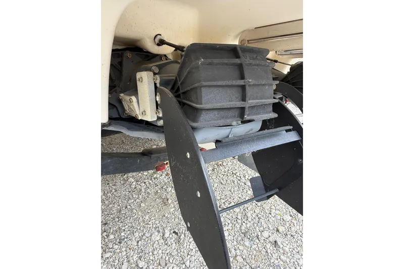 Slide: The Image of 2019 Yamaha AR210 boat engine detail on gravel surface. - 9