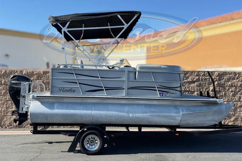 The Image of 2018 Bentley Pontoons 180 CRUISE boat with canopy on trailer, side view. - 0
