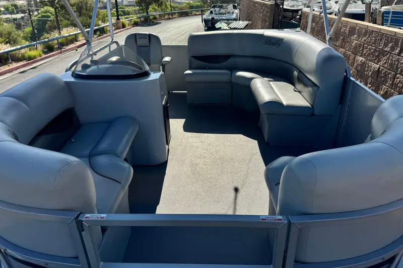Slide: The Image of 2018 Bentley Pontoons 180 CRUISE interior with spacious seating and helm. - 10