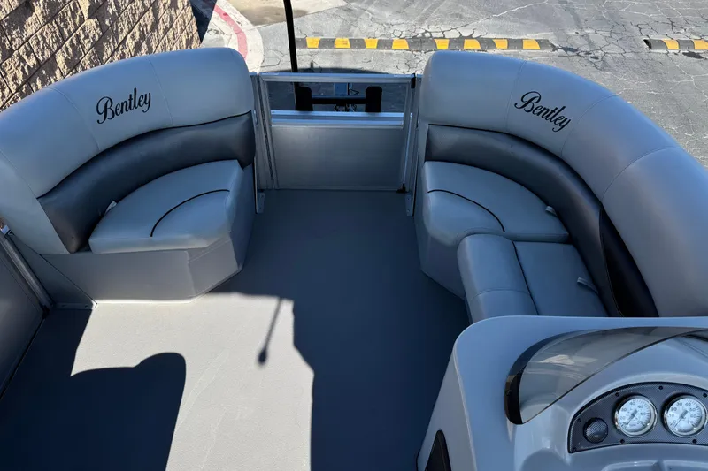 Slide: The Image of 2018 Bentley Pontoons 180 CRUISE interior with plush seating and dashboard view. - 11