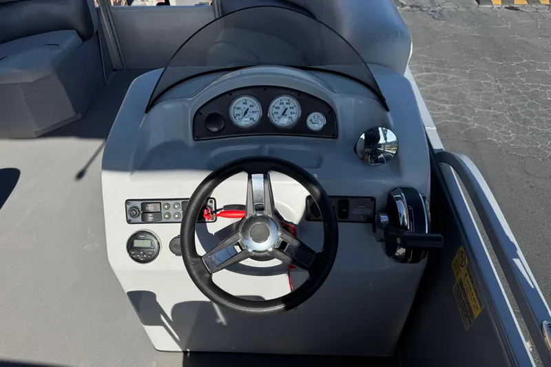 Slide: The Image of 2018 Bentley Pontoons 180 CRUISE dashboard with steering wheel and gauges. - 18