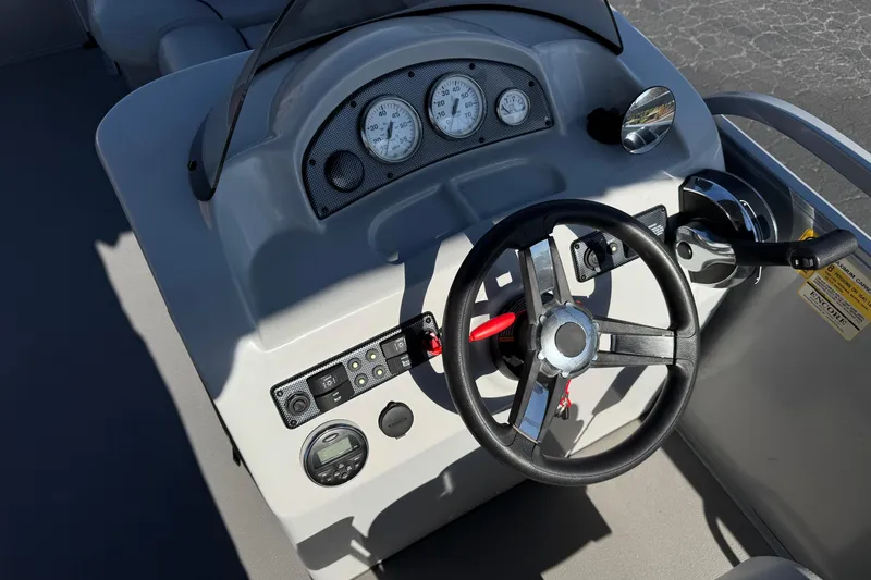 Slide: The Image of 2018 Bentley Pontoons 180 CRUISE dashboard with steering wheel and control panel. - 19